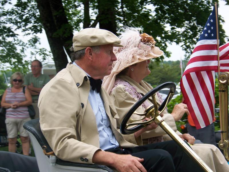 Richard Cutler and his wife Virginia participate in Marion's Fourth of July parade. The couple owns the first car officially registered in Mattapoisett. BY MATTHEW BERNAT